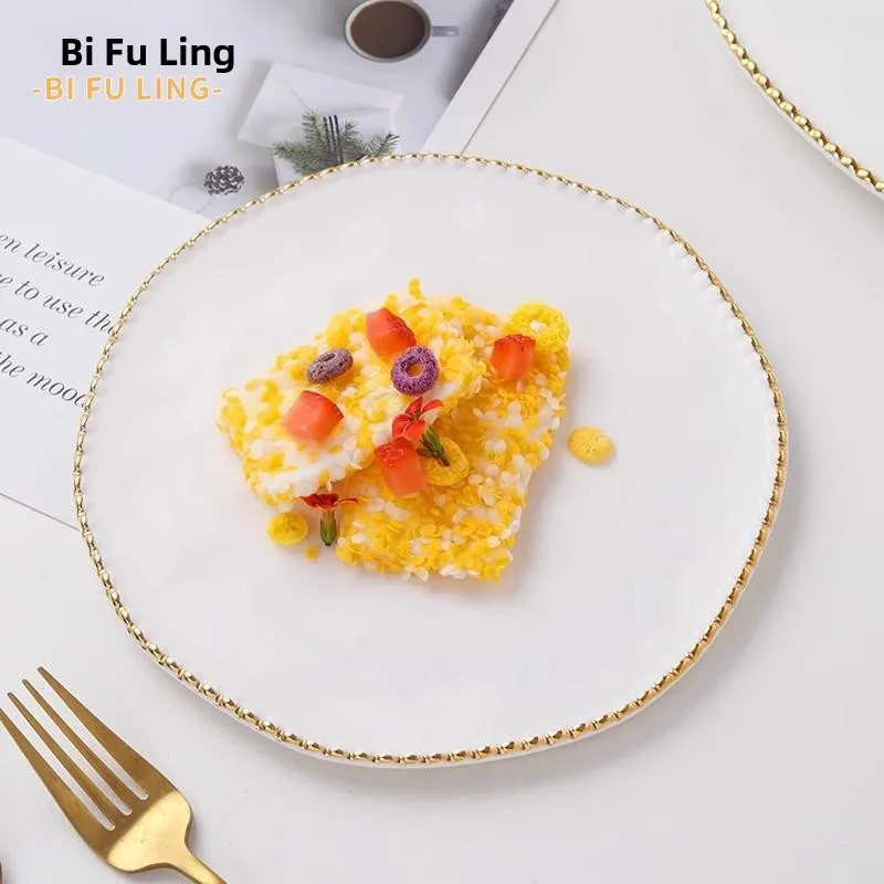 High-End Ceramic Western Steak Dinner Plate Home Use Fruit Plate Gold Rimmed Bead Cake Dish Salad Plate round Shape
High-End Ceramic Western Steak Dinner Plate Home Use Fruit Plate Gold Rimmed Bead Cake Dish Salad Plate round Shape