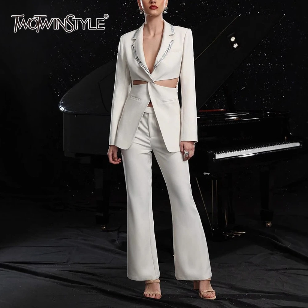 TWOTWINSTYLE Solid Hollow Out Elegant Two Piece Sets for Women Lapel Long Sleeves Spliced Hot Fix Top High Waist Pant Set Female
TWOTWINSTYLE Solid Hollow Out Elegant Two Piece Sets for Women Lapel Long Sleeves Spliced Hot Fix Top High Waist Pant Set Female