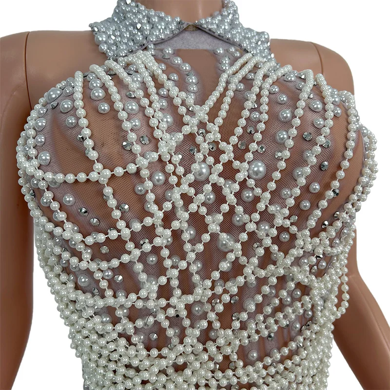 Bailing Sheer Nude Mesh Base Jumpsuit with Waterfall Pearl and Rhinestone Pattern for Evening Events and Stage Shows
Bailing Sheer Nude Mesh Base Jumpsuit with Waterfall Pearl and Rhinestone Pattern for Evening Events and Stage Shows