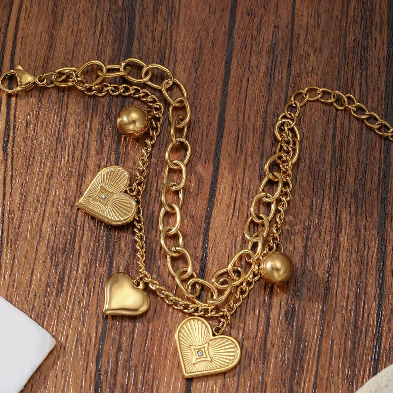 Golden Tone Stainless Steel Double Chain Heart Charm Bracelet for Women
Golden Tone Stainless Steel Double Chain Heart Charm Bracelet for Women