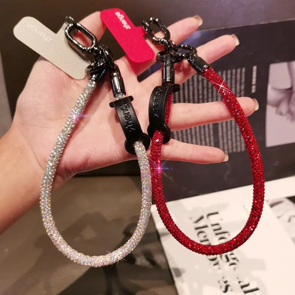 Hanging Cord Glitter Rhinestone Phone Lanyard Handheld Luxury Diamond Phone Rope Short Wrist Style Anti Loss Mobile Phone Chain
Hanging Cord Glitter Rhinestone Phone Lanyard Handheld Luxury Diamond Phone Rope Short Wrist Style Anti Loss Mobile Phone Chain