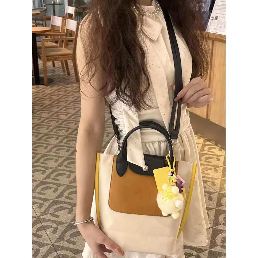 New Color Block Nylon Tote Bag Two-Way Handheld & Crossbody Purse Unique Designer Commuter Bag Stylish Versatile Shoulder Bag
New Color Block Nylon Tote Bag Two-Way Handheld & Crossbody Purse Unique Designer Commuter Bag Stylish Versatile Shoulder Bag