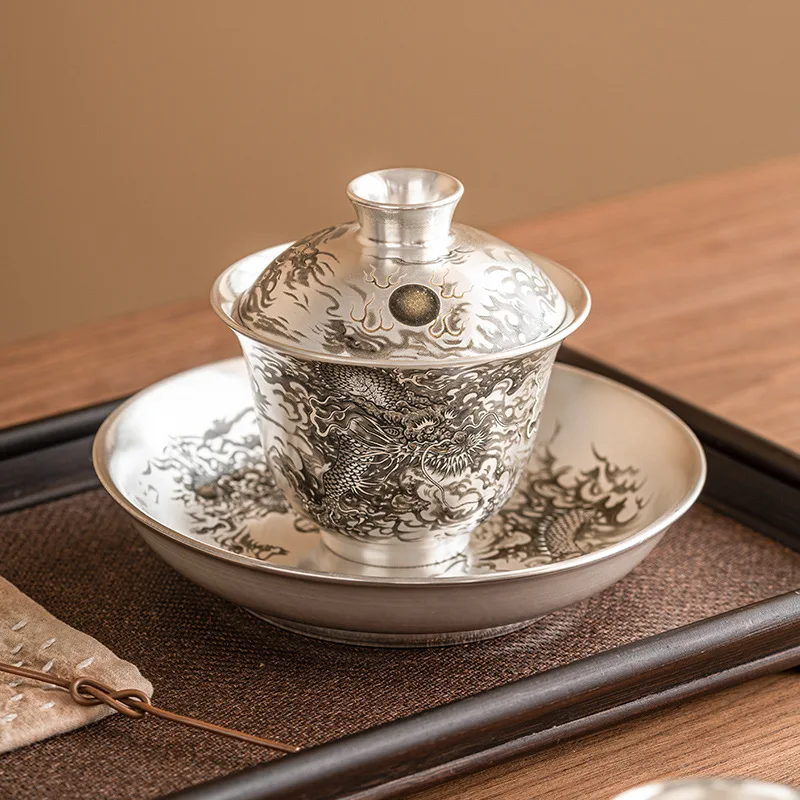 Dragon Play Bead 999 sterling silver porcelain tire ******lver Sancai cover bowl single high-end Chinese tea set tea bowl tea cu
Dragon Play Bead 999 sterling silver porcelain tire ******lver Sancai cover bowl single high-end Chinese tea set tea bowl tea cu