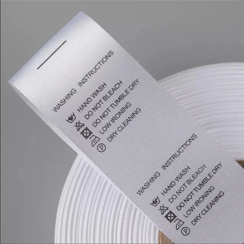Custom Garment Printing Brand Name Logo White Silk Satin Wash Care Label With Washing Instruction For Clothing
Custom Garment Printing Brand Name Logo White Silk Satin Wash Care Label With Washing Instruction For Clothing