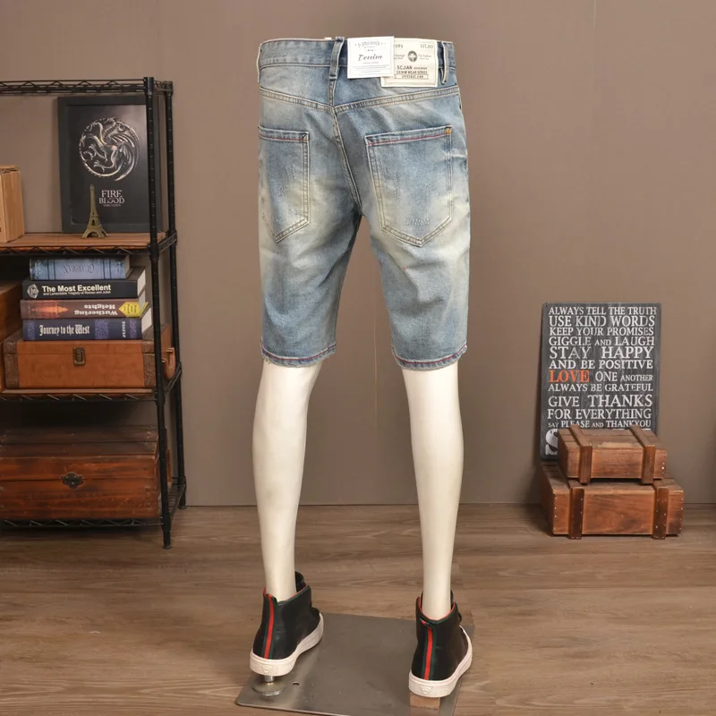 Summer ripped five quarter jeans men's stretch straight leg trendy brand scratch embroidered high-end casual shorts
Summer ripped five quarter jeans men's stretch straight leg trendy brand scratch embroidered high-end casual shorts
