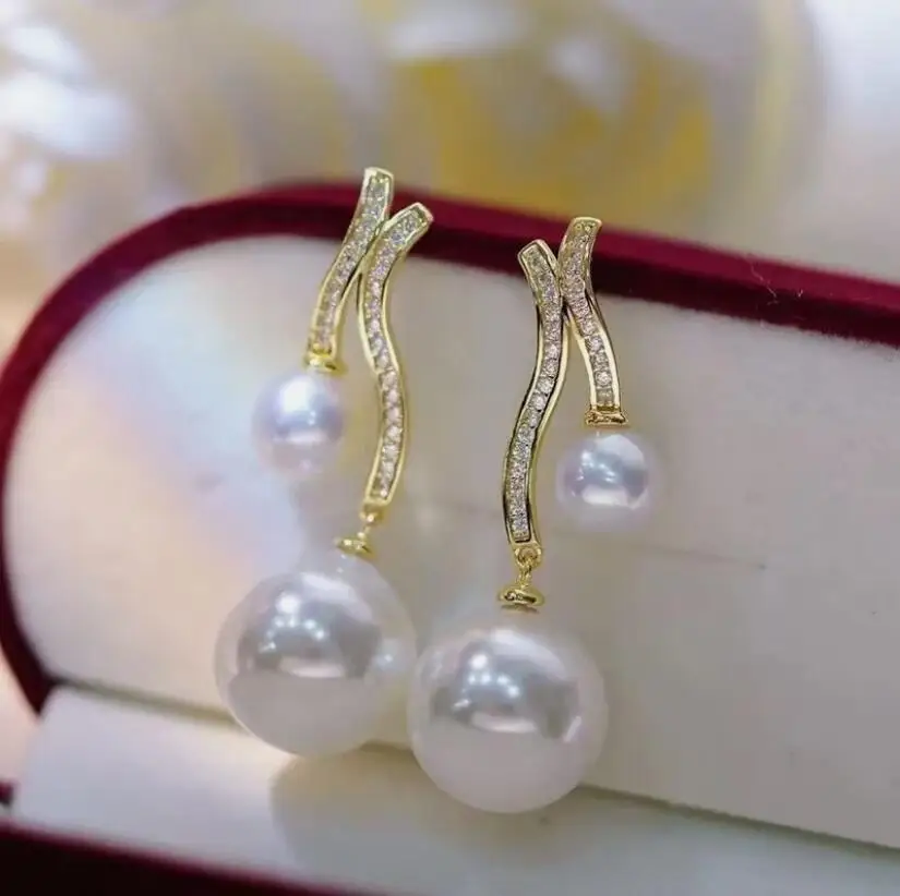 classic pair of 6-9mm round south sea white pearl dangle earring 925s
classic pair of 6-9mm round south sea white pearl dangle earring 925s