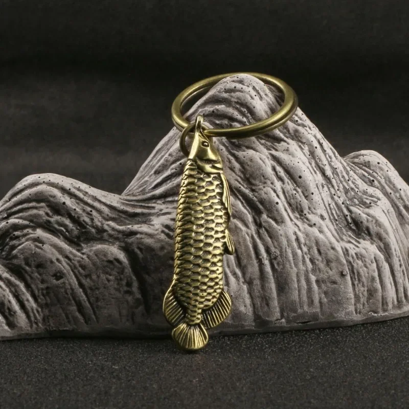 Antique Brass Arowana Figurine Desktop Decor Ornaments Tea Pet Toy Animal Fish Key Chains Pendant DIY Accessories Gift
Antique Brass Arowana Figurine Desktop Decor Ornaments Tea Pet Toy Animal Fish Key Chains Pendant DIY Accessories Gift