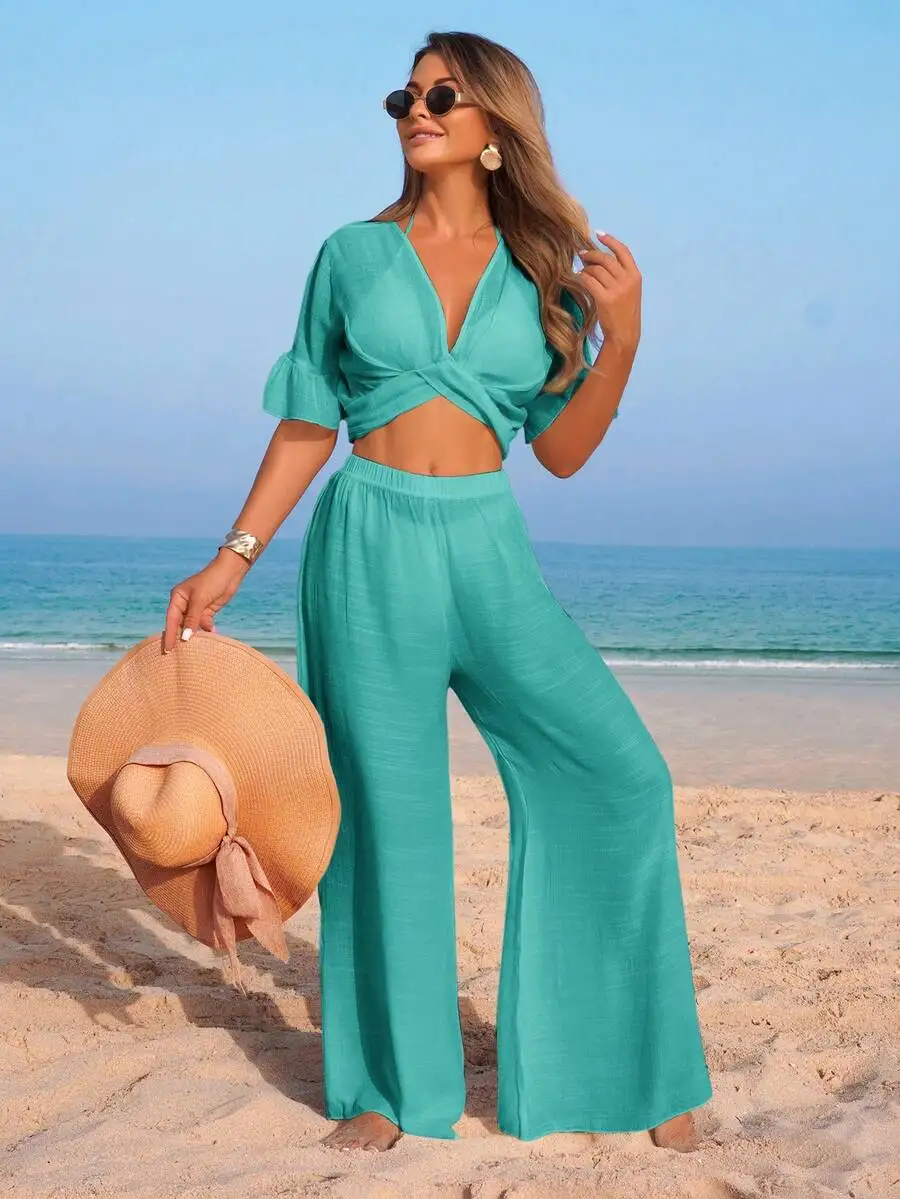 Women Solid V-Neck Ruffled Short Sleeve Crop Top And Wide Leg Pants Beach Outfit
Women Solid V-Neck Ruffled Short Sleeve Crop Top And Wide Leg Pants Beach Outfit