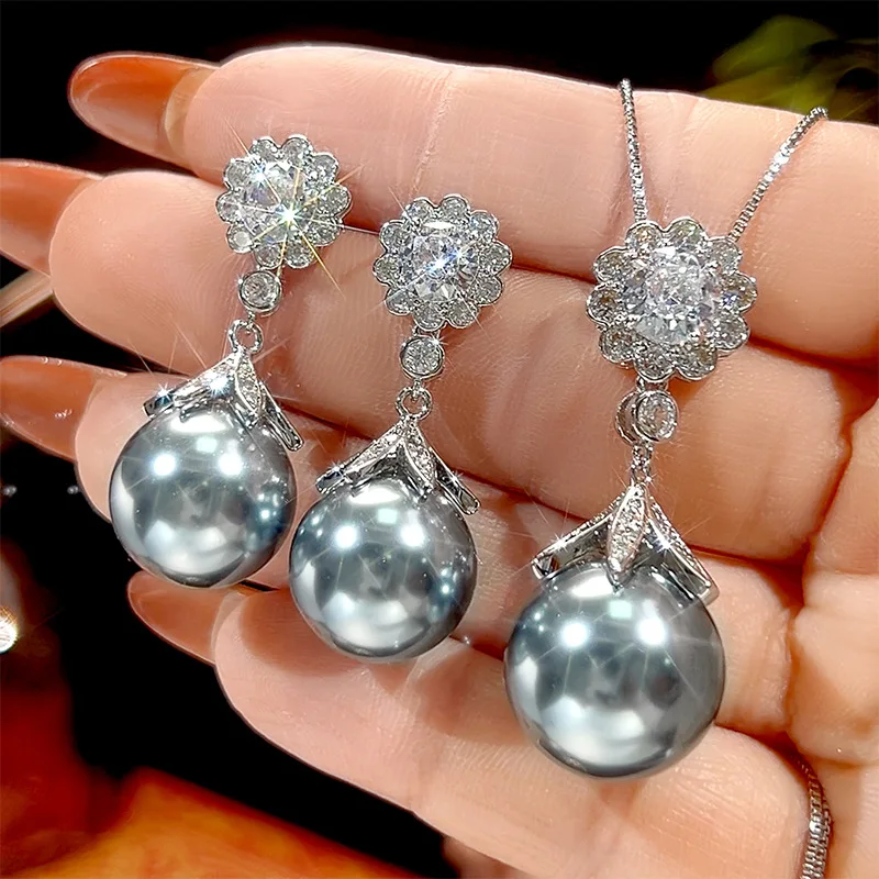 New jewelry set copper base, gold-plated, inlaid with white pearls, round shape, light luxury style for women, 16-14mm
New jewelry set copper base, gold-plated, inlaid with white pearls, round shape, light luxury style for women, 16-14mm