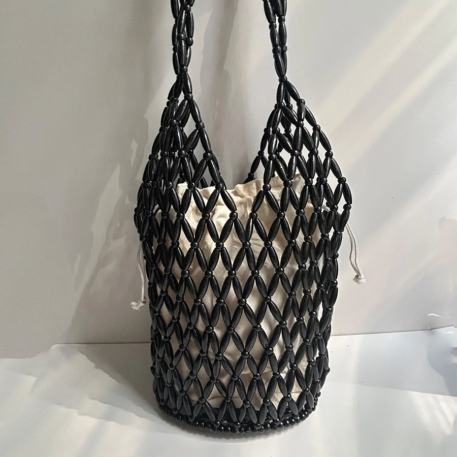 Women Woven Hand Bag Exquisite Design Hollow-out Wooden Bead Tote Bucket Shoulder Bag With Canvas Inner Bag Summer Beach Handbag
Women Woven Hand Bag Exquisite Design Hollow-out Wooden Bead Tote Bucket Shoulder Bag With Canvas Inner Bag Summer Beach Handbag