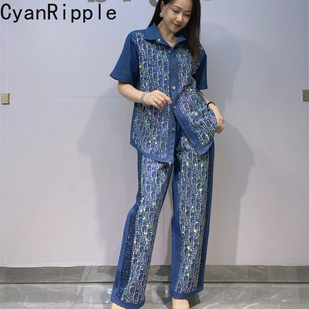 Fashionable Spring Summer Women Denim Sets Shiny Letters Hot Diamonds Short Sleeve Shirt Top + Elastic Waist Wide Leg Pants
Fashionable Spring Summer Women Denim Sets Shiny Letters Hot Diamonds Short Sleeve Shirt Top + Elastic Waist Wide Leg Pants
