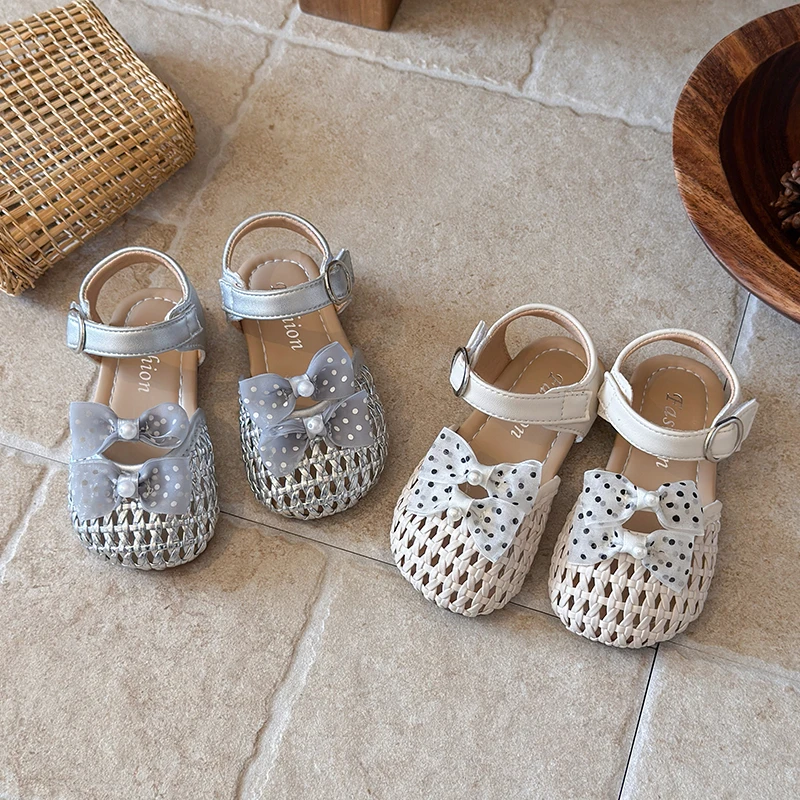 Girls' Princess Sandals Summer 2026 Woven Hollow Breathable Flat Bottom Shoes with Polka Dot Bowknot Children's Shoes 23-33
Girls' Princess Sandals Summer 2026 Woven Hollow Breathable Flat Bottom Shoes with Polka Dot Bowknot Children's Shoes 23-33