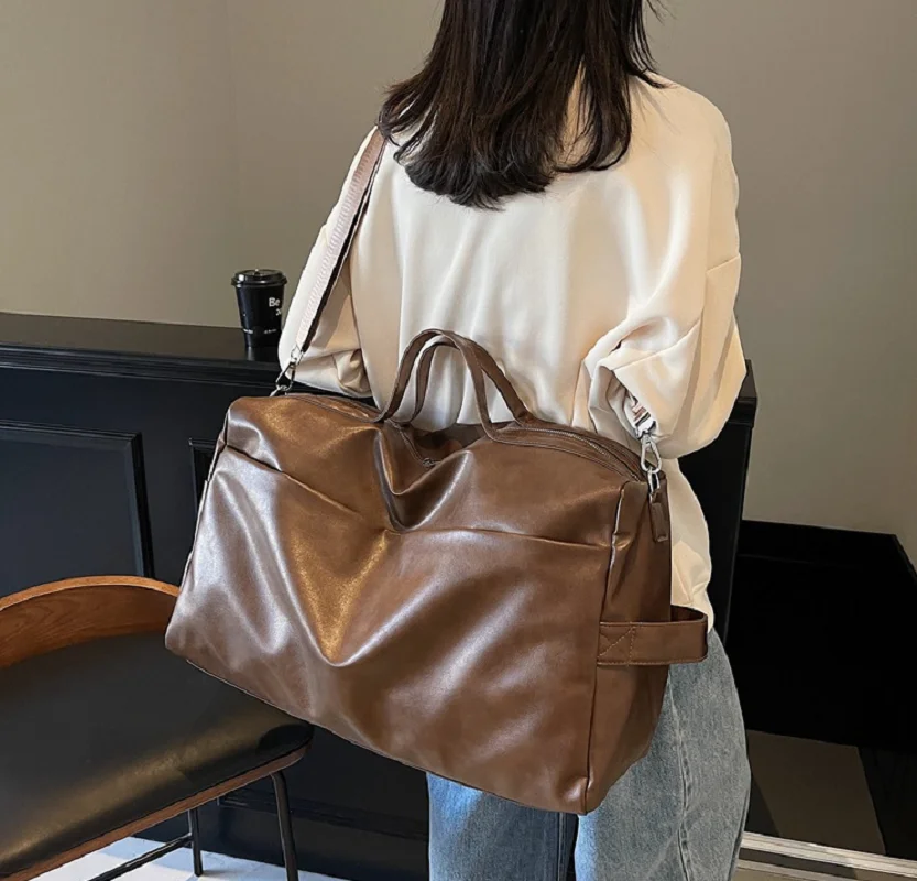 New Men Women's Fashion Business Soft Leather Travel Duffle Totes Large Capacity Shoulder Bags Sports Fitness Bag Handbag
New Men Women's Fashion Business Soft Leather Travel Duffle Totes Large Capacity Shoulder Bags Sports Fitness Bag Handbag