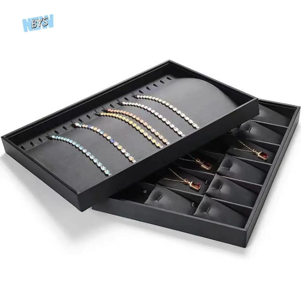 Штабелируемый лоток для демонстрации ювелирных изделий с несколькими отделениями, поддон для ювелирных изделий из искусственной кожи с плоским дном, съемные разделители, экономия места
Штабелируемый лоток для демонстрации ювелирных изделий с несколькими отделениями, поддон для ювелирных изделий из искусственной кожи с плоским дном, съемные разделители, экономия места