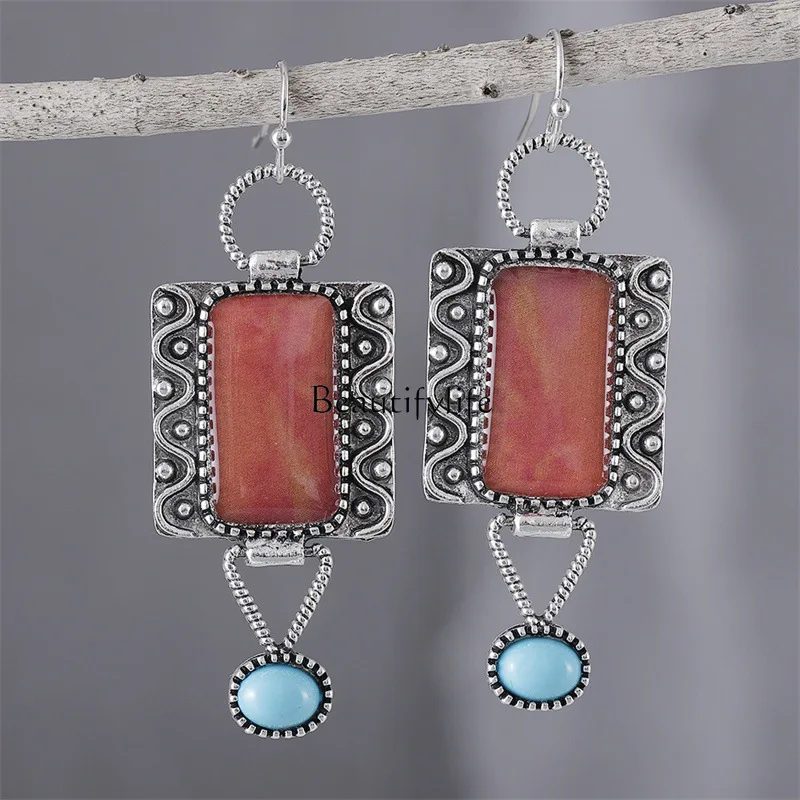 European and American retro alloy turquoise earrings lace hollow earrings fashion creative jewelry
European and American retro alloy turquoise earrings lace hollow earrings fashion creative jewelry