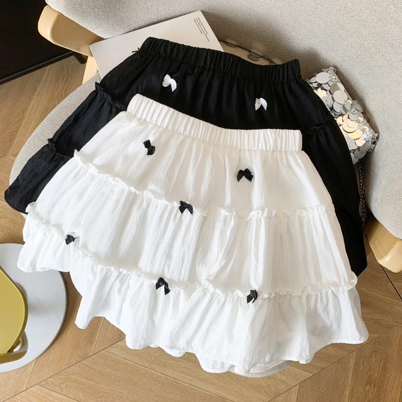 Женские юбки трапециевидной формы с милым бантом Kawaii, белые короткие юбки с высокой талией, корейская мода, черная юбка в консервативном стиле, новинка Mujer
Женские юбки трапециевидной формы с милым бантом Kawaii, белые короткие юбки с высокой талией, корейская мода, черная юбка в консервативном стиле, новинка Mujer