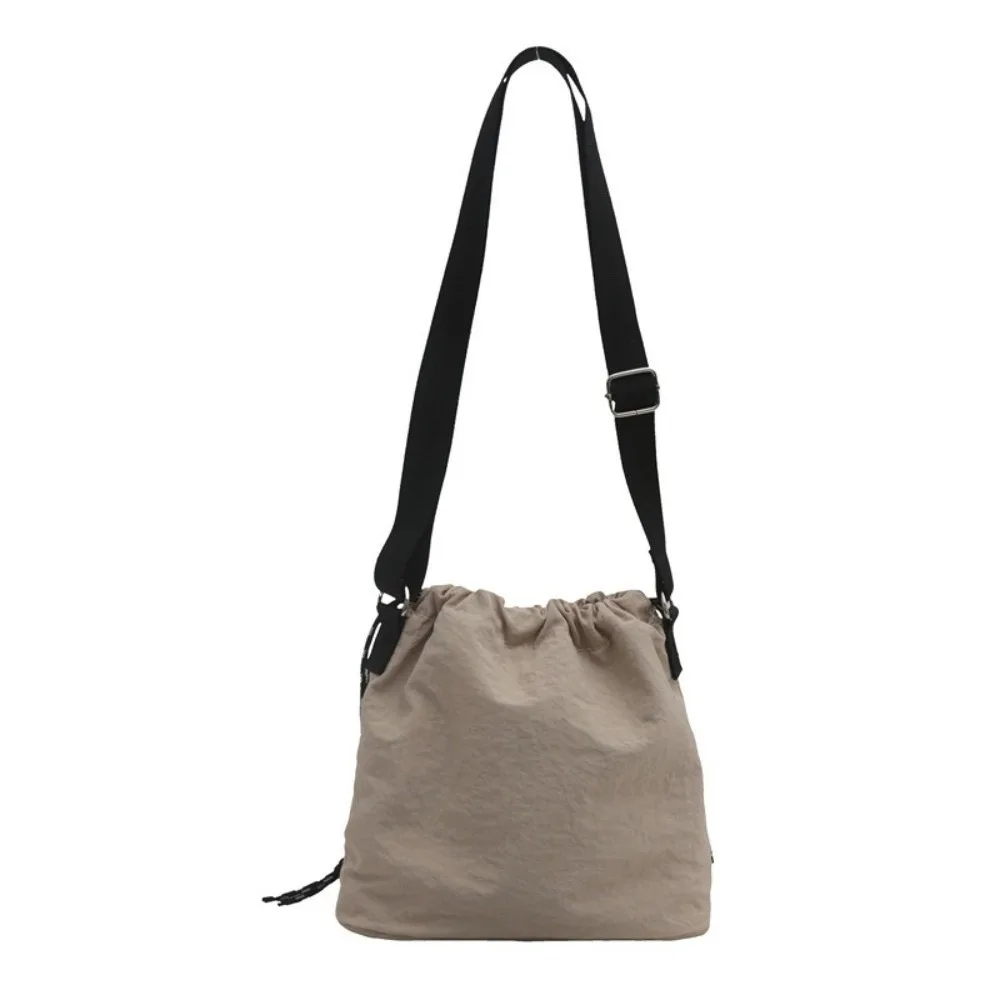 Korean Style Versatile Crossbody Bag Nylon Adjustable Strap Shoulder Bag Drawstring Bucket Bag Unisex
Korean Style Versatile Crossbody Bag Nylon Adjustable Strap Shoulder Bag Drawstring Bucket Bag Unisex
