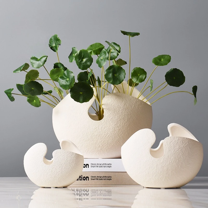 White ceramic vase ornament, modern simple European home soft decoration, living room decoration
White ceramic vase ornament, modern simple European home soft decoration, living room decoration
