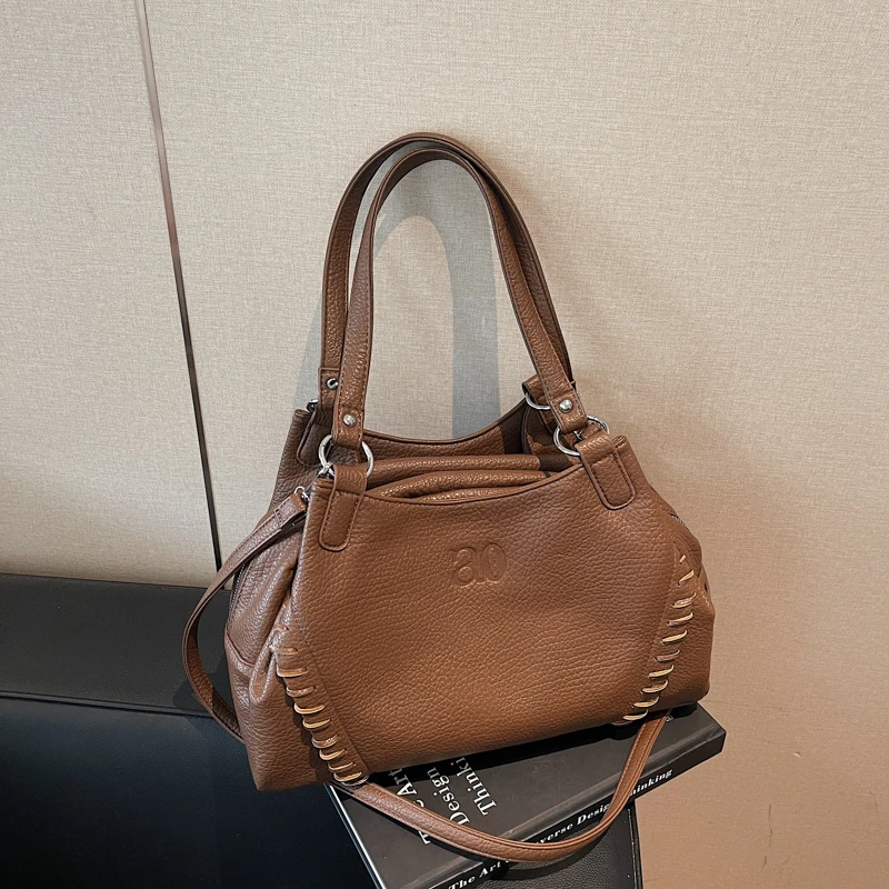 Soft Leather Motorcycle Bag Korean Designer Retro Handbag Women's Lychee Pattern Tote Bag Large Capacity Commuter Crossbody Bag
Soft Leather Motorcycle Bag Korean Designer Retro Handbag Women's Lychee Pattern Tote Bag Large Capacity Commuter Crossbody Bag