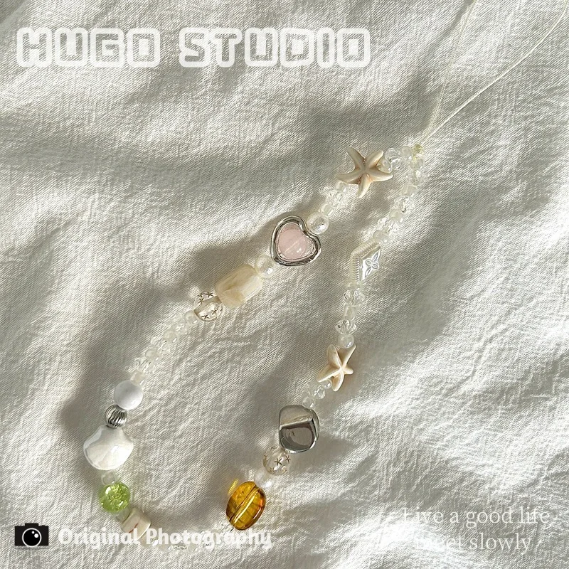 Ремешок для телефона в богемном стиле с бисером и подвеской в виде сердца, короткий ремешок для телефона для пляжного отдыха, ремешок для камеры, подвеска для наушников
Ремешок для телефона в богемном стиле с бисером и подвеской в виде сердца, короткий ремешок для телефона для пляжного отдыха, ремешок для камеры, подвеска для наушников