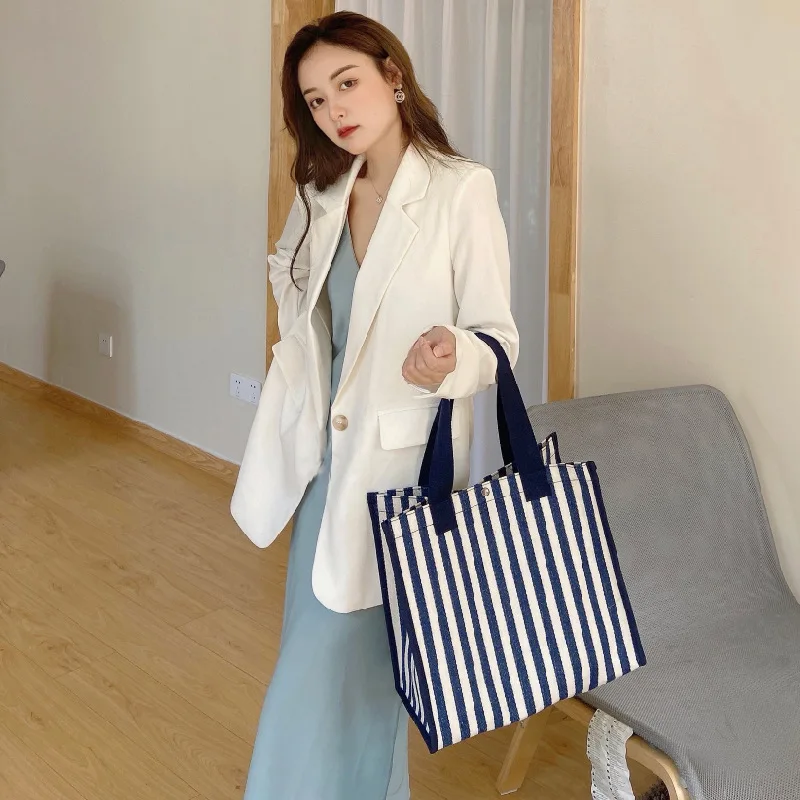Simple Stripe Portable Thickened Canvas Multi Purpose Handheld Shopping Storage Bag
Simple Stripe Portable Thickened Canvas Multi Purpose Handheld Shopping Storage Bag