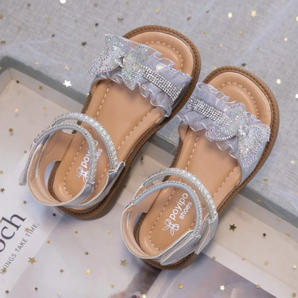 Girls Sandals Sweet Lace Bows Kids Beach Shoes Open Toes Versatile 2026 New Fashion Children Princess Shoes Casual for Summer
Girls Sandals Sweet Lace Bows Kids Beach Shoes Open Toes Versatile 2026 New Fashion Children Princess Shoes Casual for Summer