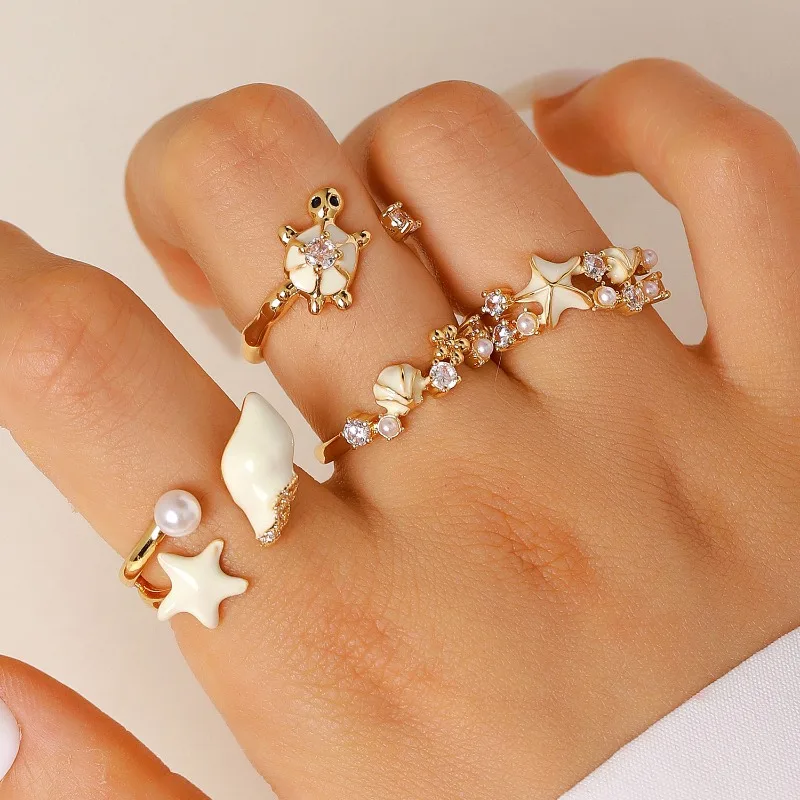 Summer vacation beach turtle starfish shell ring, light luxury drop glazed imitation pearl zircon adjustable ring
Summer vacation beach turtle starfish shell ring, light luxury drop glazed imitation pearl zircon adjustable ring