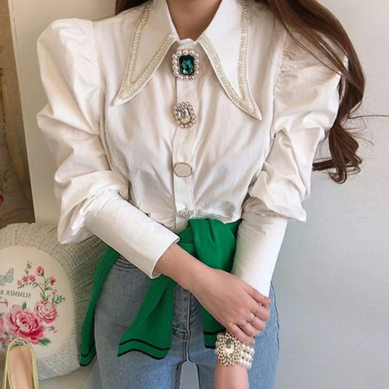 Women Shirts French Vintage Blouse Spring Button Up Shirt Pointed Collar Long Puff Sleeve Pearl Button Slim White Tops Camisas
Women Shirts French Vintage Blouse Spring Button Up Shirt Pointed Collar Long Puff Sleeve Pearl Button Slim White Tops Camisas