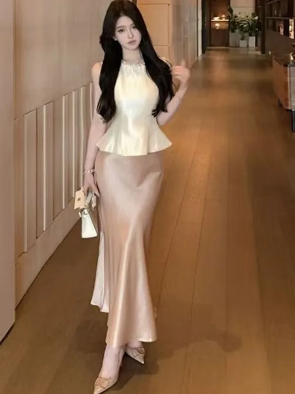 Elegant Silk Satin Two-Piece Set with Waist-Cinching Top And Fish-tail Skirt for Women Sleeveless Summer Fashion Ensemble
Elegant Silk Satin Two-Piece Set with Waist-Cinching Top And Fish-tail Skirt for Women Sleeveless Summer Fashion Ensemble