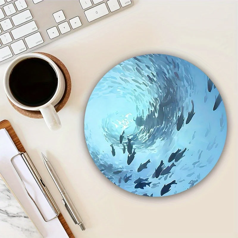 The sea-blue circular mouse pad with a swimming fish design and anti-slip rubber base is very suitable for home office use
The sea-blue circular mouse pad with a swimming fish design and anti-slip rubber base is very suitable for home office use