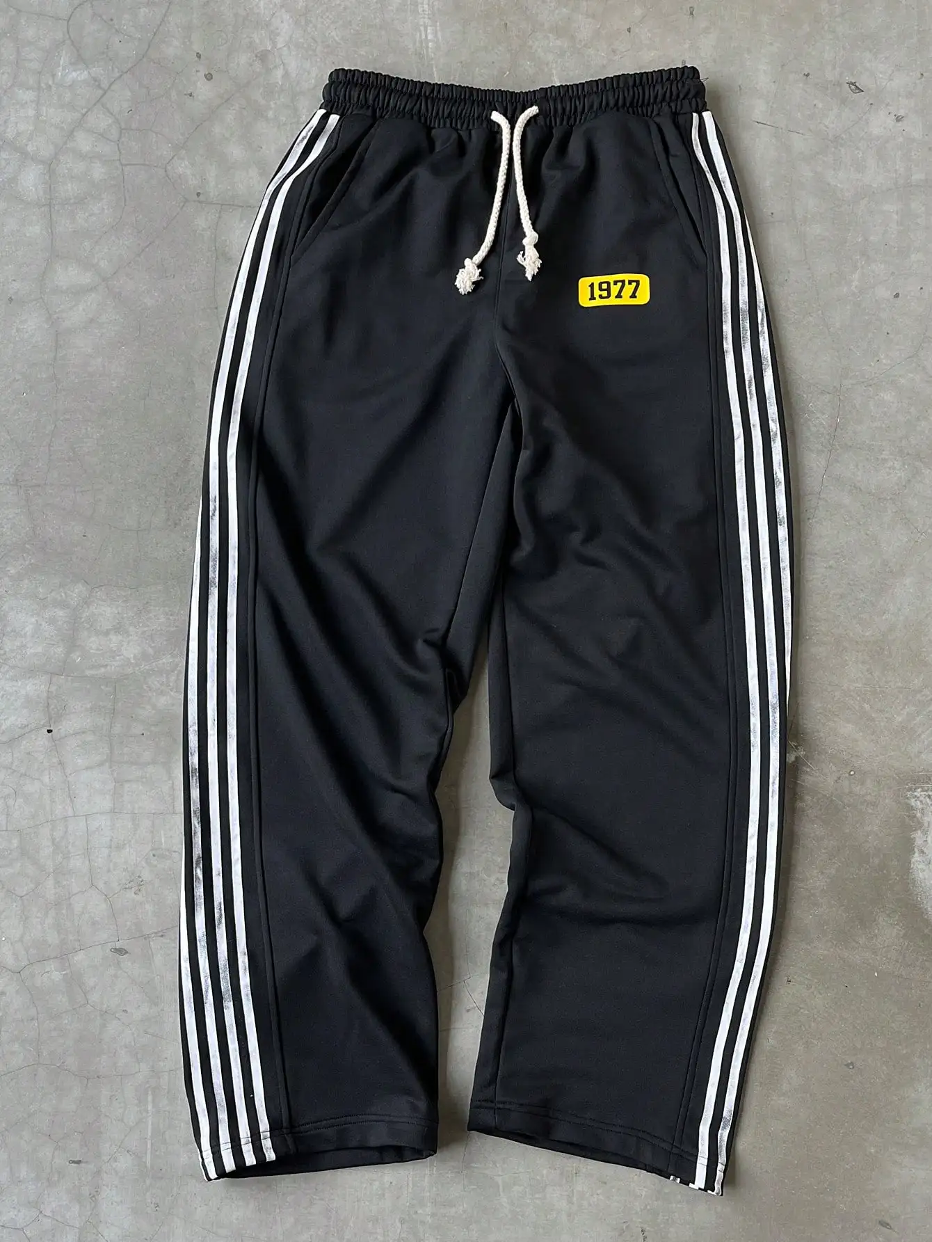 Men's Black Track Pants with White Side Stripes and Vintage Patch
Men's Black Track Pants with White Side Stripes and Vintage Patch