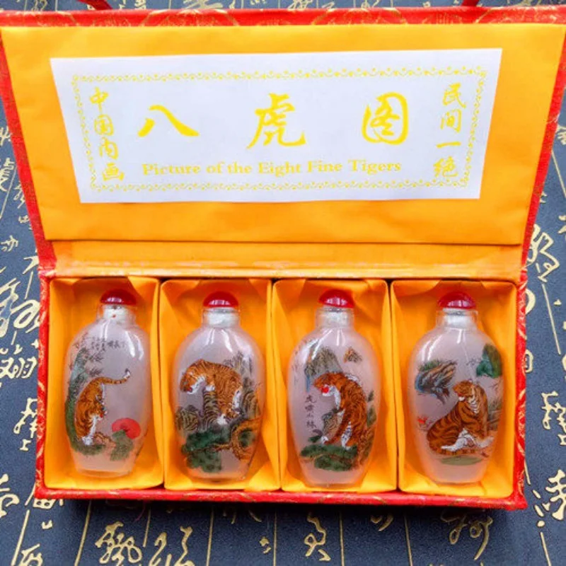Chinese exquisite inner painting snuff bottle set Painted tiger pattern Chinese Folk characteristics handicrafts and gifts
Chinese exquisite inner painting snuff bottle set Painted tiger pattern Chinese Folk characteristics handicrafts and gifts