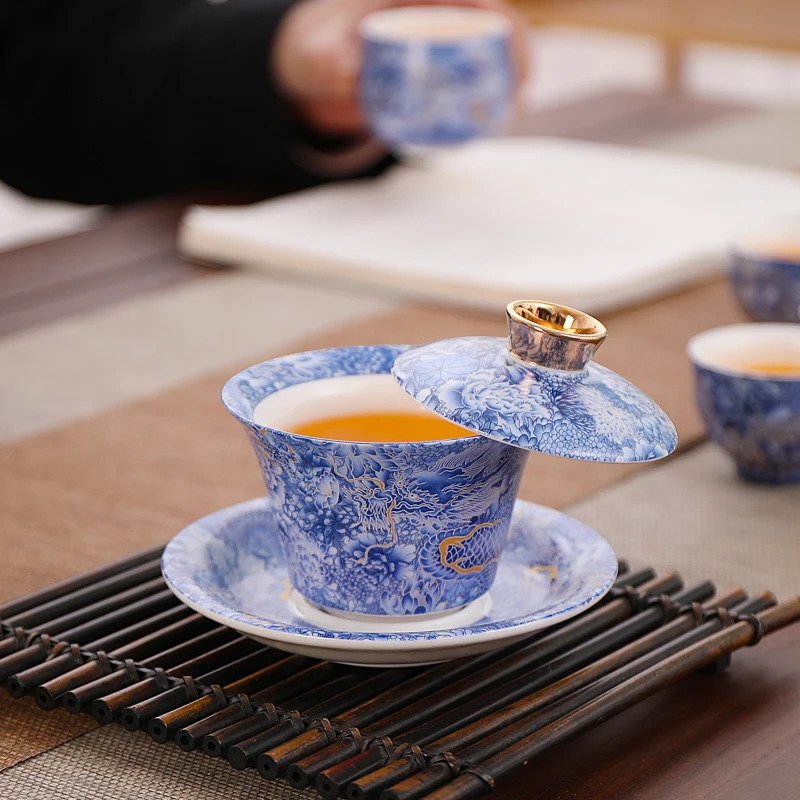 Suet jade porcelain filigree Yinlong ceramic hover cover bowl Fengming pot Kung Fu tea set 
Suet jade porcelain filigree Yinlong ceramic hover cover bowl Fengming pot Kung Fu tea set