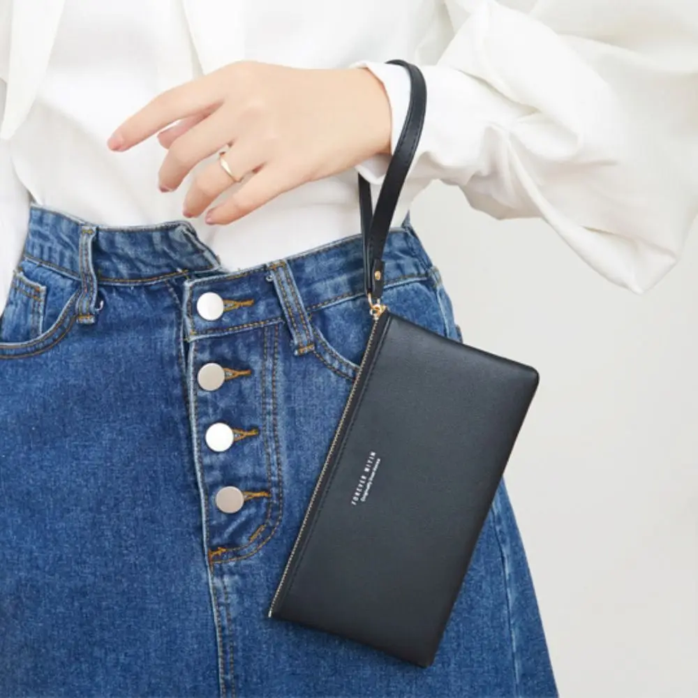 Simple Clear Handheld Phone Purse Waterproof Lightweight Touch-screen Phone Bag Wallet PU Leather Travel
Simple Clear Handheld Phone Purse Waterproof Lightweight Touch-screen Phone Bag Wallet PU Leather Travel