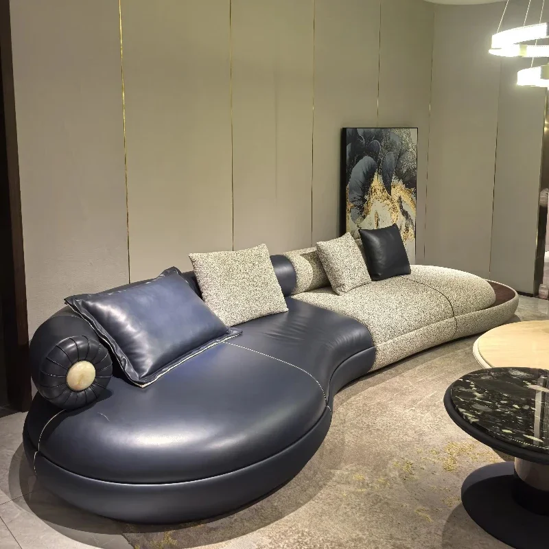 Italian luxury redefined: a designer curved U-shaped corner sofa set in suede satin leather for villas and hotel spaces.
Italian luxury redefined: a designer curved U-shaped corner sofa set in suede satin leather for villas and hotel spaces.