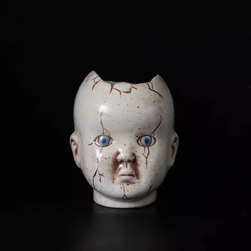 Horror themed doll head ceramic vase ornament,quirky pen holder storage,Gothic home decoration,unique Halloween decoration gift
Horror themed doll head ceramic vase ornament,quirky pen holder storage,Gothic home decoration,unique Halloween decoration gift