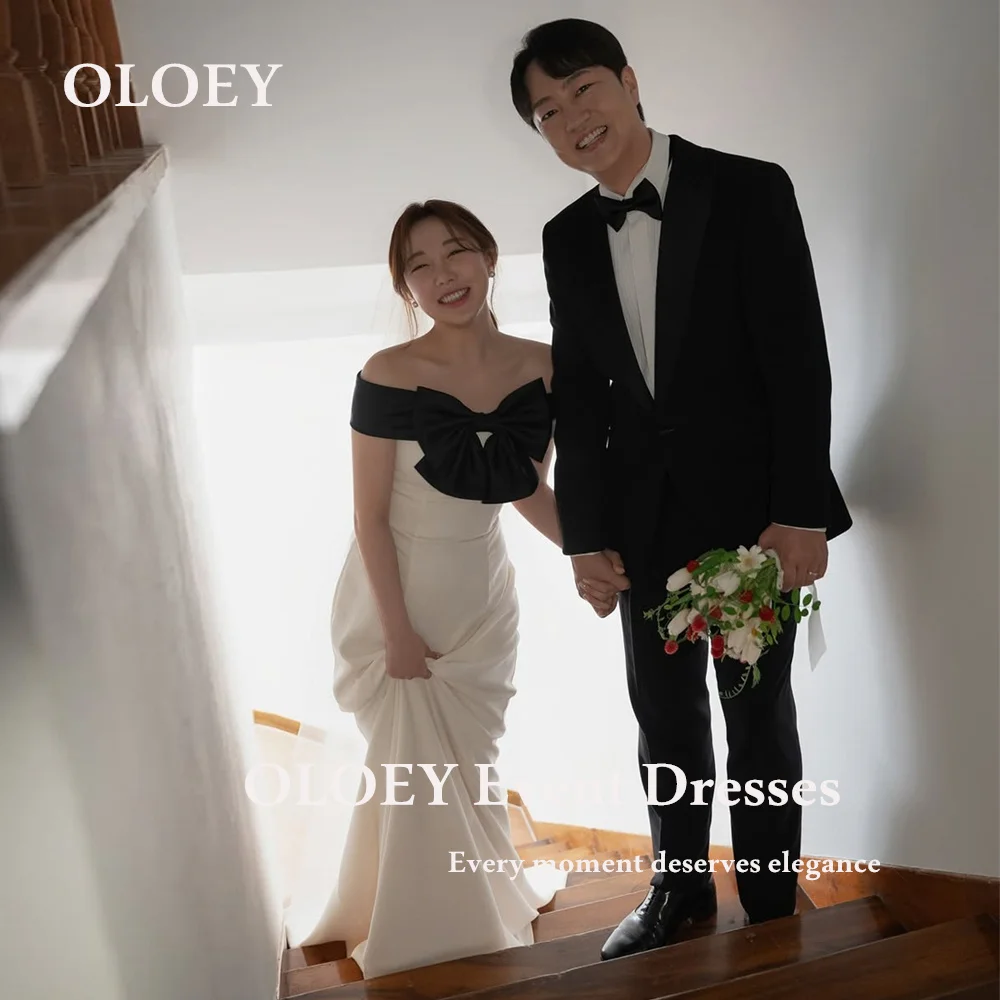 OLOEY Простые вечерние платья русалки Корейская фотосессия с открытыми плечами длиной до пола, свадебное платье с черным бантом, корсет по индивидуальному заказу
OLOEY Простые вечерние платья русалки Корейская фотосессия с открытыми плечами длиной до пола, свадебное платье с черным бантом, корсет по индивидуальному заказу