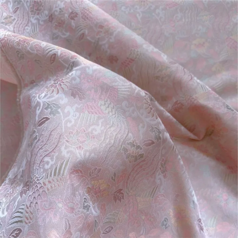 A traditional Chinese-style waistcoat and cheongsam dress made of blend colored differently silk jacquard fabric
A traditional Chinese-style waistcoat and cheongsam dress made of blend colored differently silk jacquard fabric