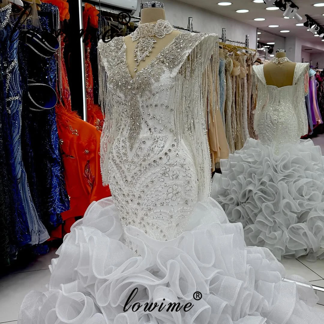 Роскошное вечернее платье цвета слоновой кости с длинными рукавами, силуэт «русалка», высокий воротник, для выпускного вечера, с бисером, кристаллами и бахромой, свадебное или для торжеств, на заказ
Роскошное вечернее платье цвета слоновой кости с длинными рукавами, силуэт «русалка», высокий воротник, для выпускного вечера, с бисером, кристаллами и бахромой, свадебное или для торжеств, на заказ