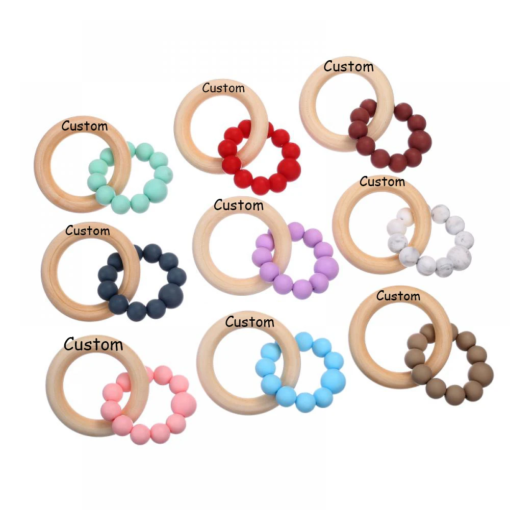 Customized Name Baby Teething Bracelet Beech Wood Rings Creative Baby Silicone Bite Grinding Bracelet Baby Toy Bebes Accesorios
Customized Name Baby Teething Bracelet Beech Wood Rings Creative Baby Silicone Bite Grinding Bracelet Baby Toy Bebes Accesorios