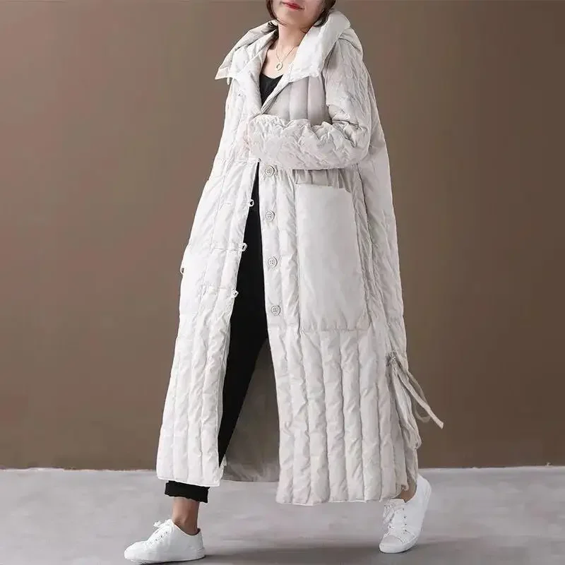 Winter Women Coat 2025 Long Loose Stand Collar Hooded Single Breasted Coat Bottom Lace Up Design Big Pocket Thicken Warm Jackets
Winter Women Coat 2025 Long Loose Stand Collar Hooded Single Breasted Coat Bottom Lace Up Design Big Pocket Thicken Warm Jackets