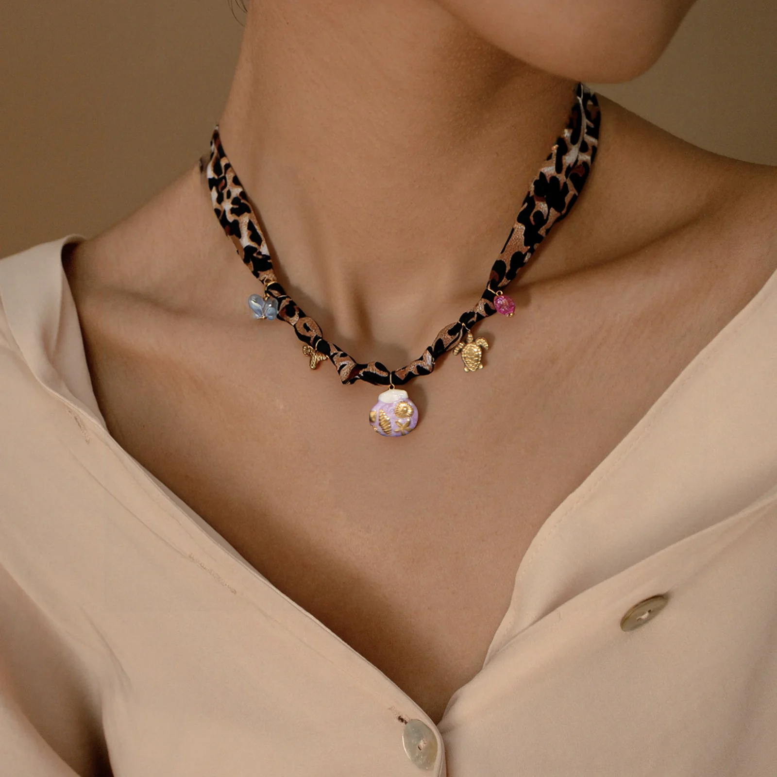 Leopard Print Silk Choker with Ocean & Crystal Charms
Leopard Print Silk Choker with Ocean & Crystal Charms