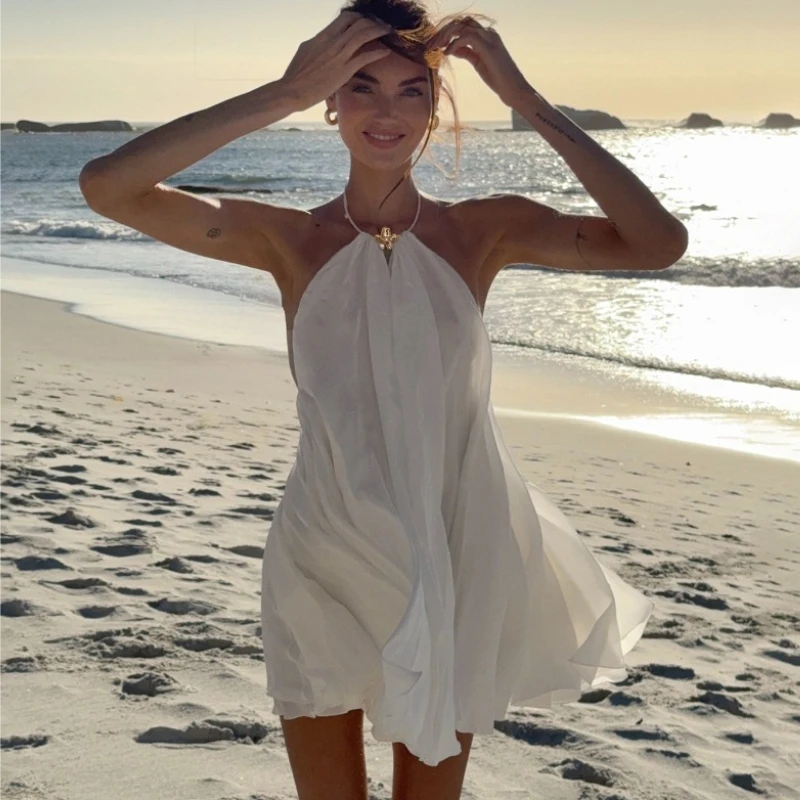 TARUXY Solid Floral Metal Buckle Dress Women Neck-Mounted Sleeveless Sexy Backless Loose Vacation Dress 2026 Summer Female Dress
TARUXY Solid Floral Metal Buckle Dress Women Neck-Mounted Sleeveless Sexy Backless Loose Vacation Dress 2026 Summer Female Dress