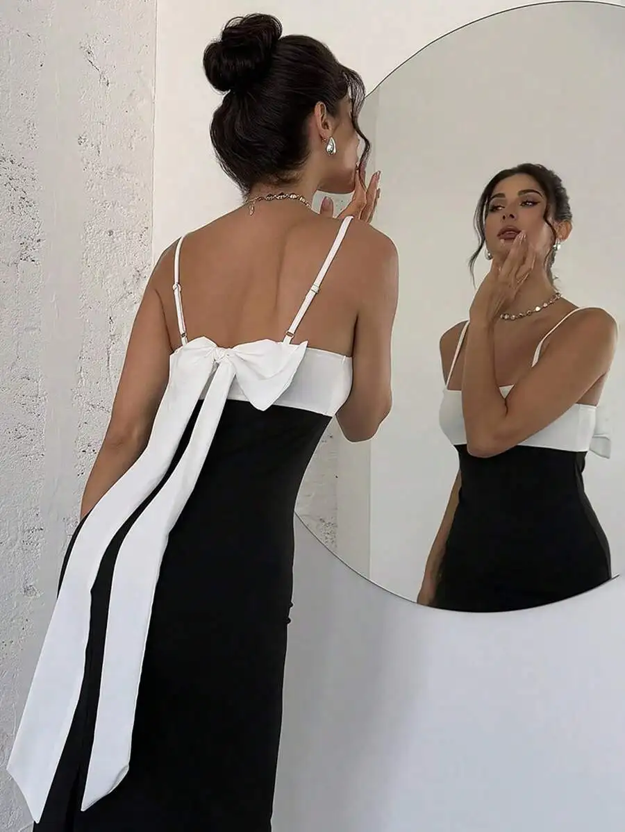 Женское черно-белое платье с открытой спиной, на тонких бретелях и с бантом
Женское черно-белое платье с открытой спиной, на тонких бретелях и с бантом