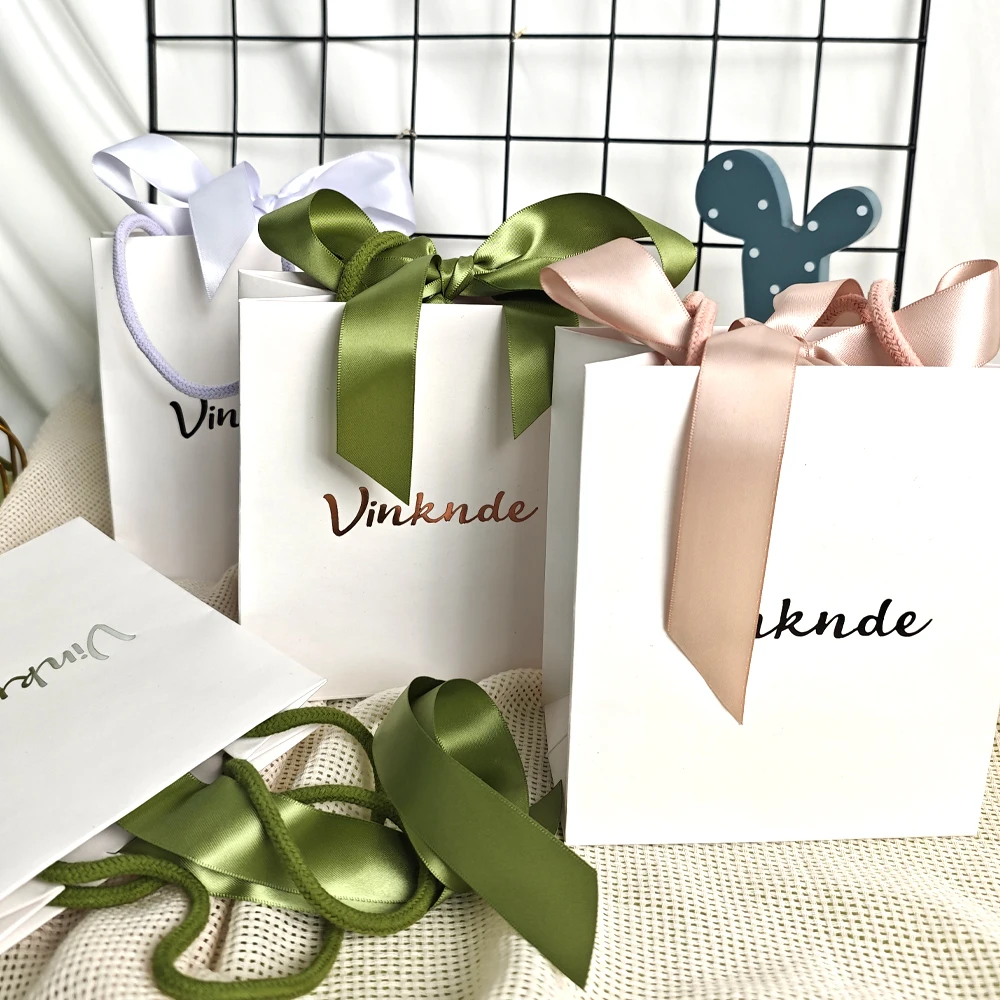 Custom Logo Printed White Gift Paper Tote Bags with Bow Ribbon Rope Kraft Handle Shopping Bag Wedding Baby Shower Packaging Sack
Custom Logo Printed White Gift Paper Tote Bags with Bow Ribbon Rope Kraft Handle Shopping Bag Wedding Baby Shower Packaging Sack