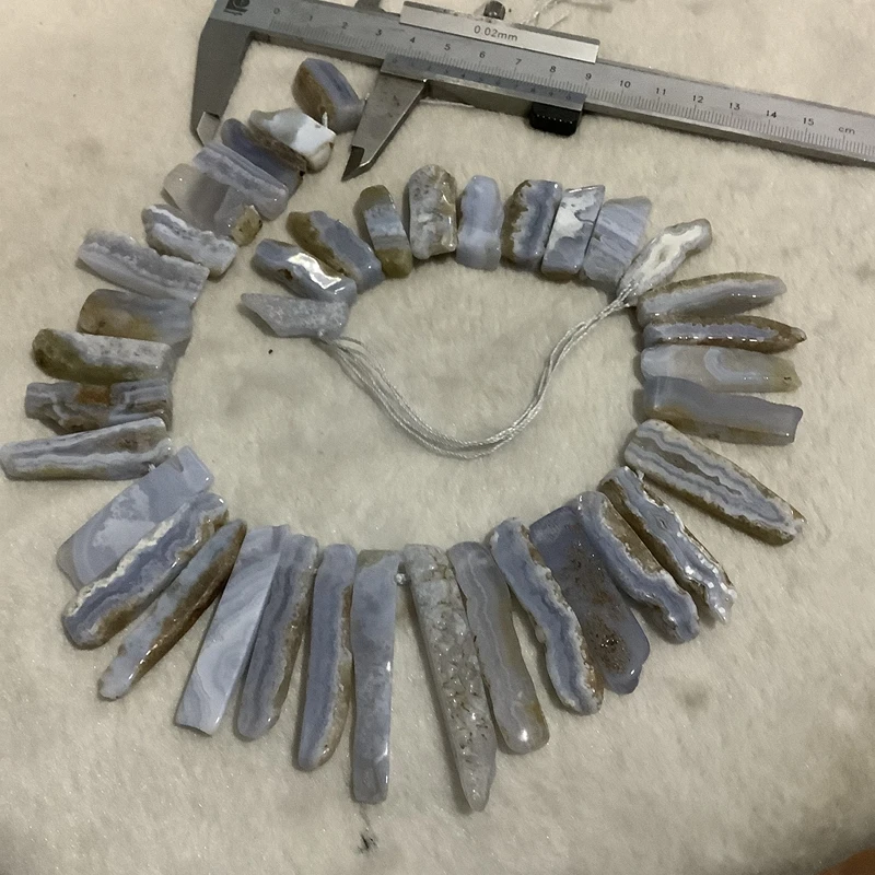PANGEM Wholesale Genuine Blue Lace Agate Long Nugget Beads 15 Strand Chalcedony Loose Gemstone for Jewelry Making
PANGEM Wholesale Genuine Blue Lace Agate Long Nugget Beads 15 Strand Chalcedony Loose Gemstone for Jewelry Making