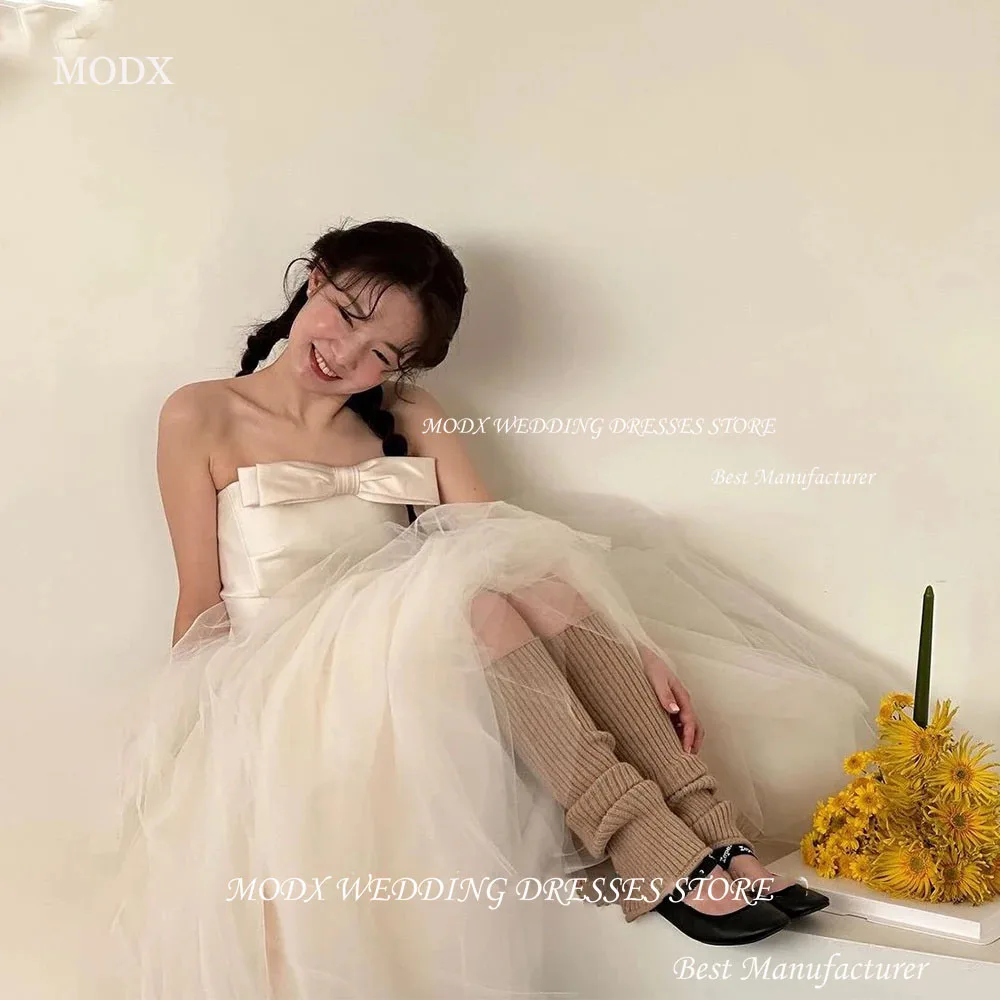 MODX Простое корейское свадебное платье трапециевидной формы без бретелек для фотосессии из атласа и тюля без рукавов с бантом Свадебные платья на заказ
MODX Простое корейское свадебное платье трапециевидной формы без бретелек для фотосессии из атласа и тюля без рукавов с бантом Свадебные платья на заказ