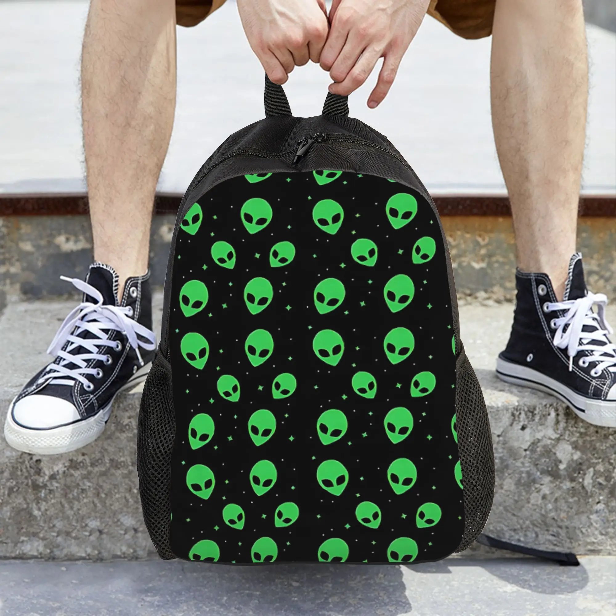 A Sleek Backpack Featuring a Pattern of Green Aliens And Stars, Perfect for Keeping Your Essentials Organized While You Go to Cl
A Sleek Backpack Featuring a Pattern of Green Aliens And Stars, Perfect for Keeping Your Essentials Organized While You Go to Cl