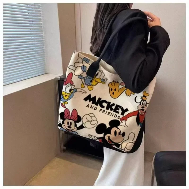 Сумка на плечо с Микки Маусом, Минни, мультяшный милый персонаж, парусиновая модная повседневная студенческая сумка-тоут большой вместимости, сумка
Сумка на плечо с Микки Маусом, Минни, мультяшный милый персонаж, парусиновая модная повседневная студенческая сумка-тоут большой вместимости, сумка
