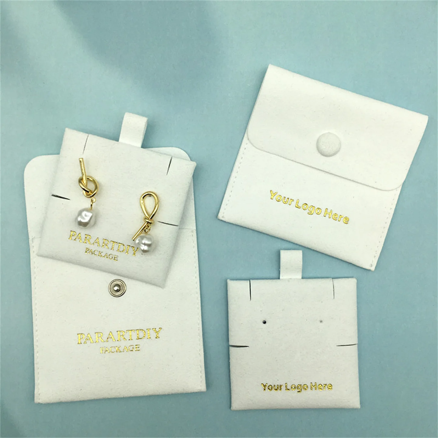 50 pieces white bag with buttons microfiber bag necklace earrings wholesale custom logo jewelry bagging brooch small bag
50 pieces white bag with buttons microfiber bag necklace earrings wholesale custom logo jewelry bagging brooch small bag